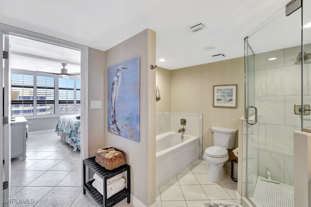 full bathroom featuring tile patterned floors, vanity, toilet, and shower with separate bathtub