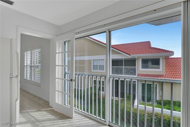 unfurnished sunroom featuring visible vents