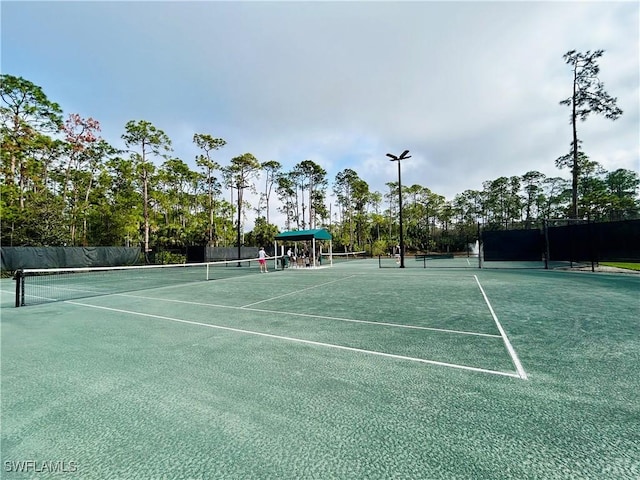 view of sport court with fence