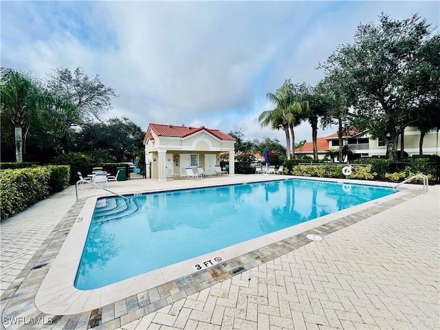 community pool with a patio area