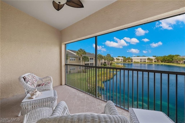 balcony featuring a water view