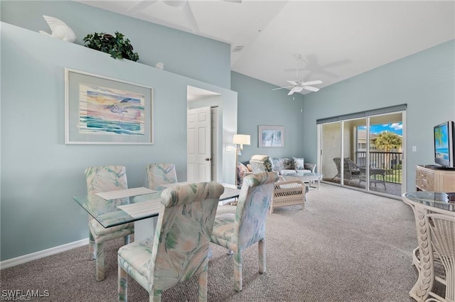 dining space featuring carpet floors, ceiling fan, and lofted ceiling