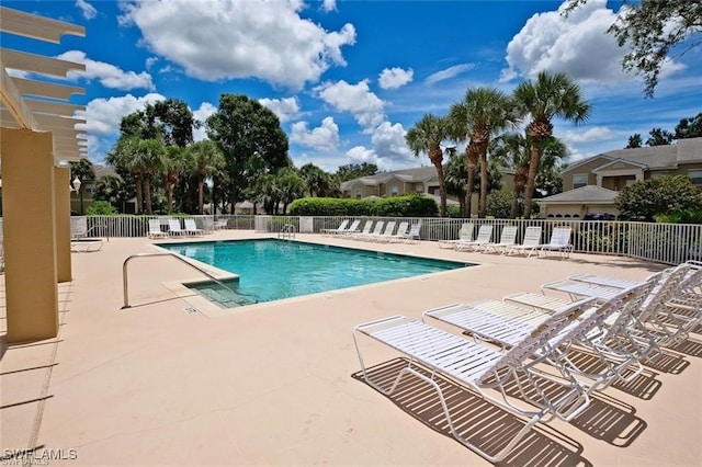 view of swimming pool with a patio