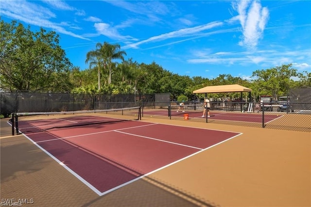 view of sport court featuring basketball hoop