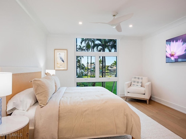 bedroom with hardwood / wood-style flooring and ceiling fan