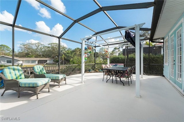 view of patio featuring a lanai