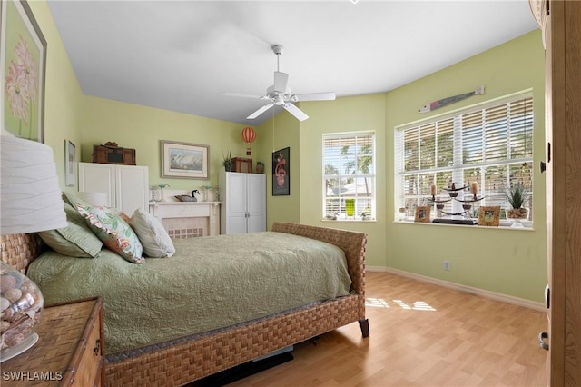 bedroom featuring ceiling fan and light hardwood / wood-style floors