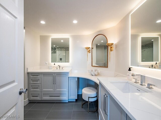 bathroom featuring tile patterned floors and vanity