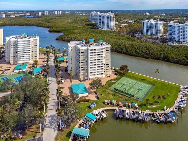 birds eye view of property with a water view