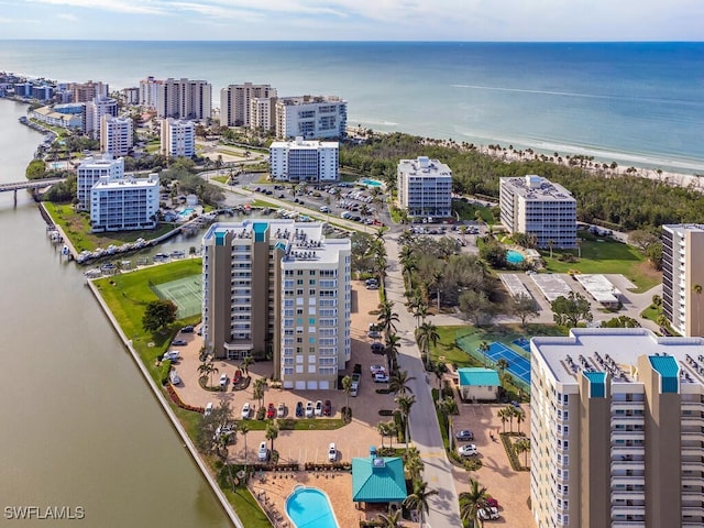 birds eye view of property featuring a water view and a view of the beach