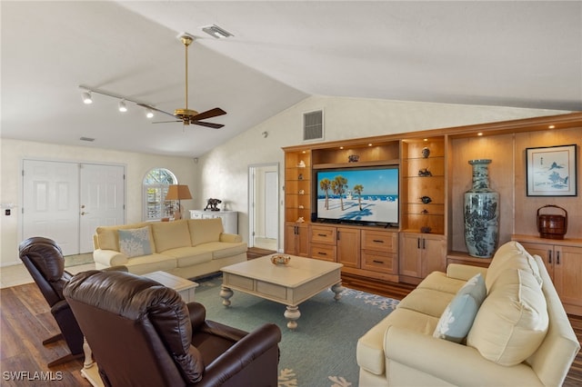 living room featuring ceiling fan, dark hardwood / wood-style flooring, and lofted ceiling