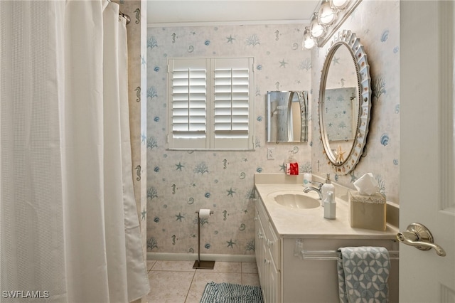 bathroom featuring tile patterned flooring and vanity