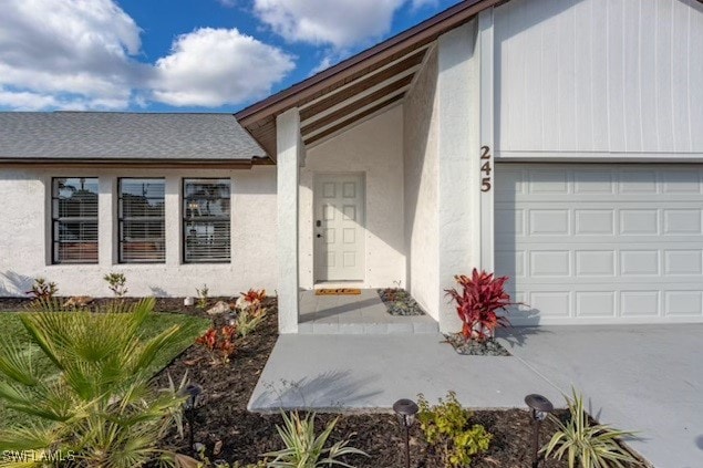 doorway to property featuring a garage