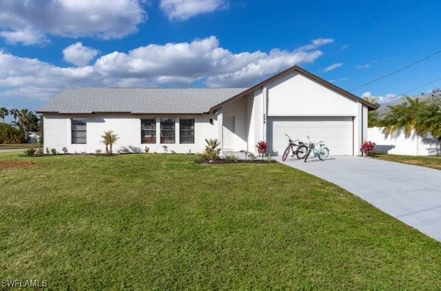 single story home featuring a garage and a front yard