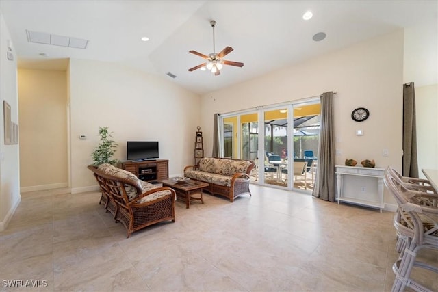 living room featuring ceiling fan and vaulted ceiling