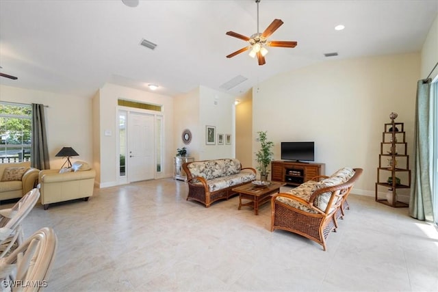 living room featuring ceiling fan and vaulted ceiling