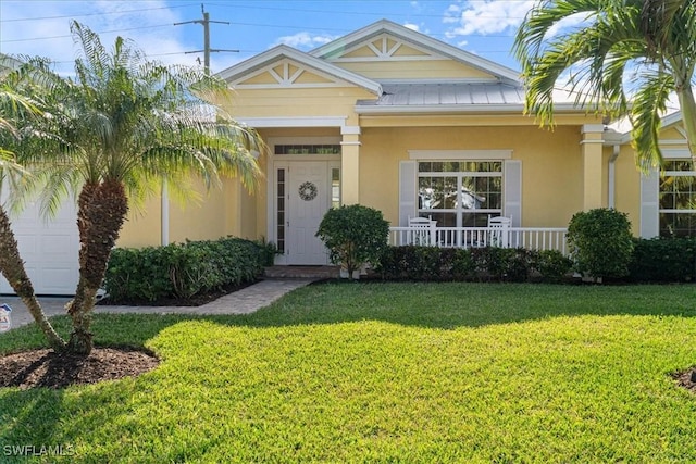 view of front of property with a front lawn and covered porch