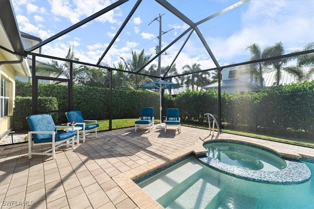 view of swimming pool featuring an in ground hot tub, a lanai, and a patio