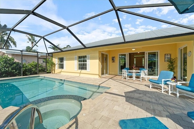 view of pool with a patio area, a lanai, and ceiling fan