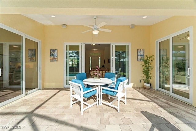 view of patio featuring ceiling fan