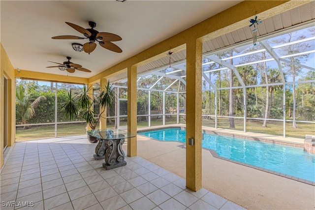 view of pool featuring a patio area, ceiling fan, and a lanai