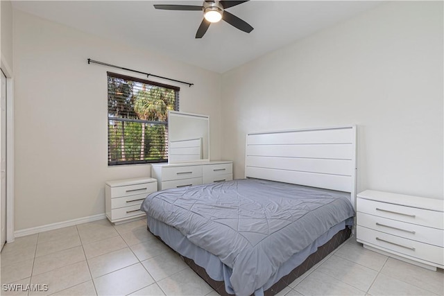 bedroom featuring light tile patterned floors and ceiling fan