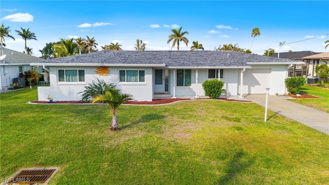 single story home with a front yard and a garage