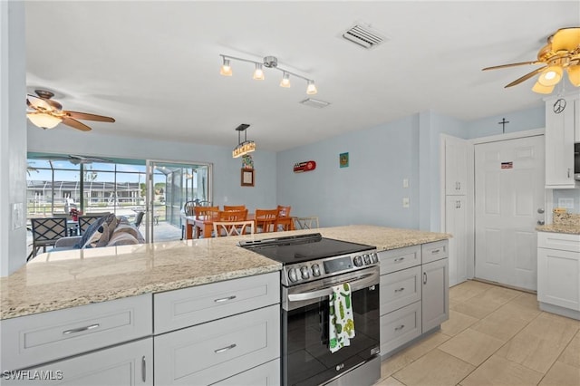 kitchen with light stone countertops, ceiling fan, decorative light fixtures, stainless steel electric range, and white cabinets