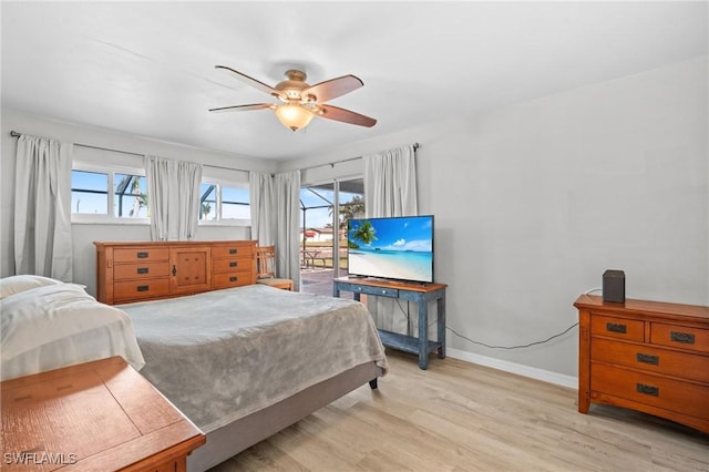 bedroom with ceiling fan, access to exterior, and light hardwood / wood-style flooring