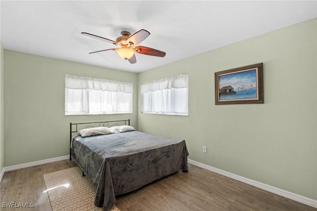 bedroom featuring hardwood / wood-style flooring and ceiling fan