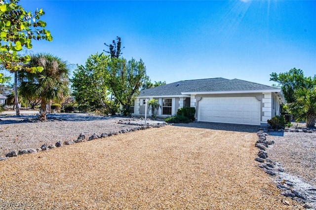 single story home featuring a garage