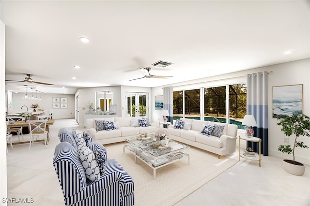 living room with light tile patterned floors and ceiling fan