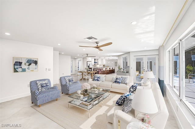 living room with french doors and ceiling fan