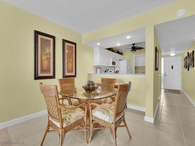 dining room featuring ceiling fan and light tile patterned flooring