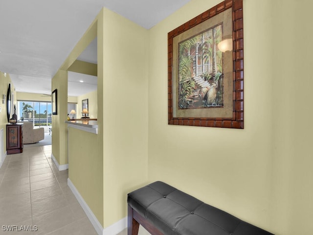 hallway featuring light tile patterned floors