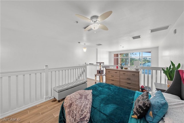 bedroom with light wood-type flooring and ceiling fan