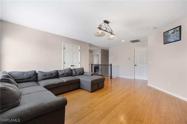 living room with light hardwood / wood-style flooring