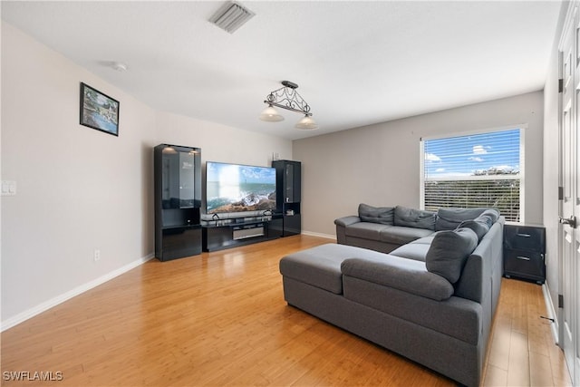 living room with light hardwood / wood-style flooring