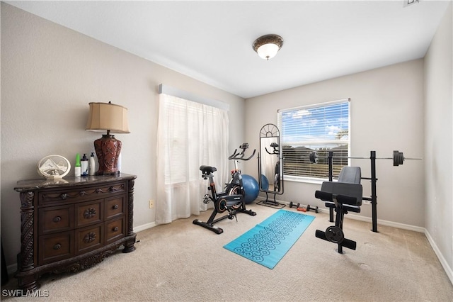 exercise room with light carpet