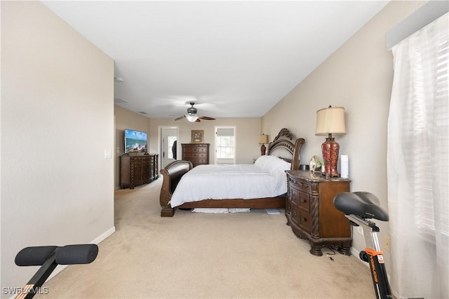 bedroom featuring ceiling fan and light colored carpet