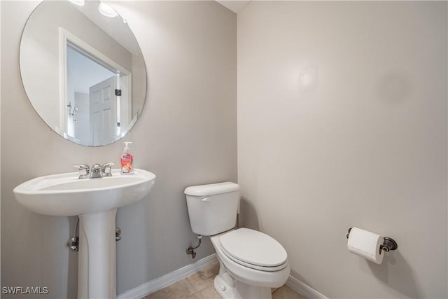 bathroom with toilet and sink