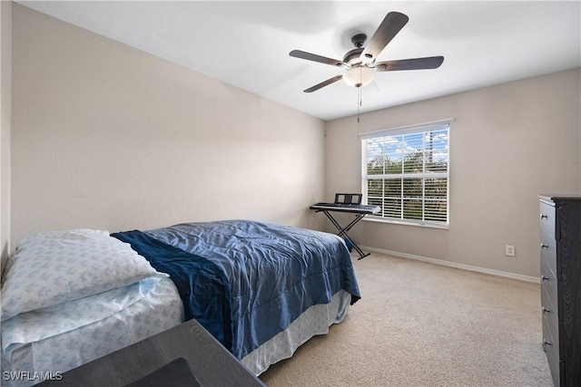 bedroom featuring ceiling fan and light colored carpet