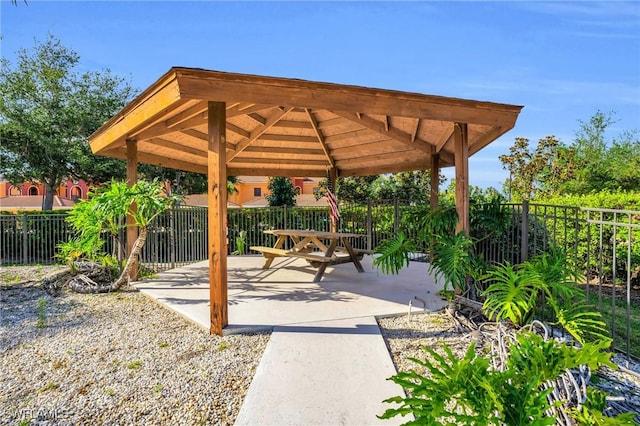 view of property's community with a gazebo and a patio area