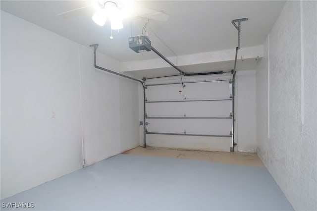 garage with ceiling fan and a garage door opener