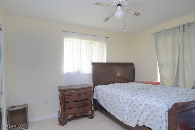 tiled bedroom with ceiling fan