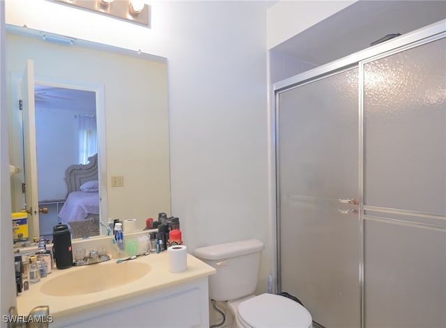 bathroom with vanity, toilet, and walk in shower