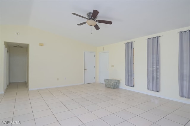 tiled empty room with ceiling fan