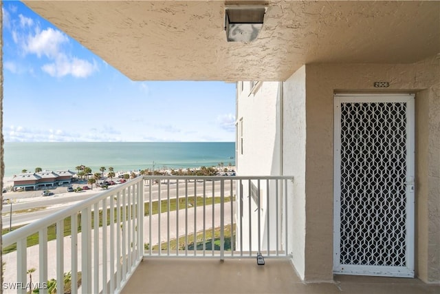 balcony featuring a water view