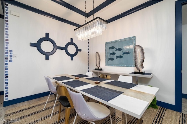 dining room featuring hardwood / wood-style flooring and an inviting chandelier