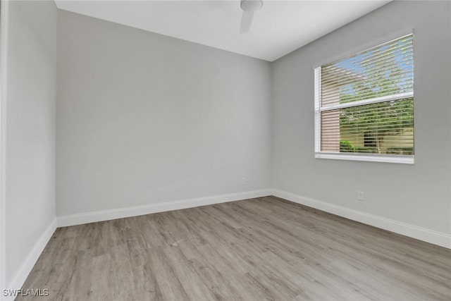 unfurnished room featuring ceiling fan and light hardwood / wood-style flooring